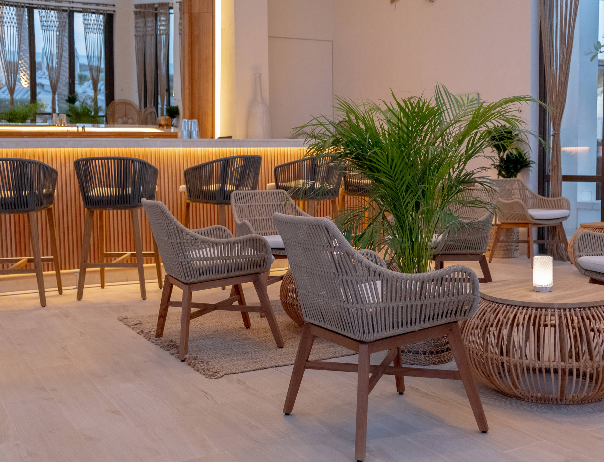 Stylish rustic seating at Cabana 9, a chic poolside bar and lounge at Saadiyat Beach Club in Abu Dhabi.
